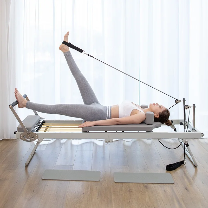Commercial Pilates reformer in a bright boutique studio