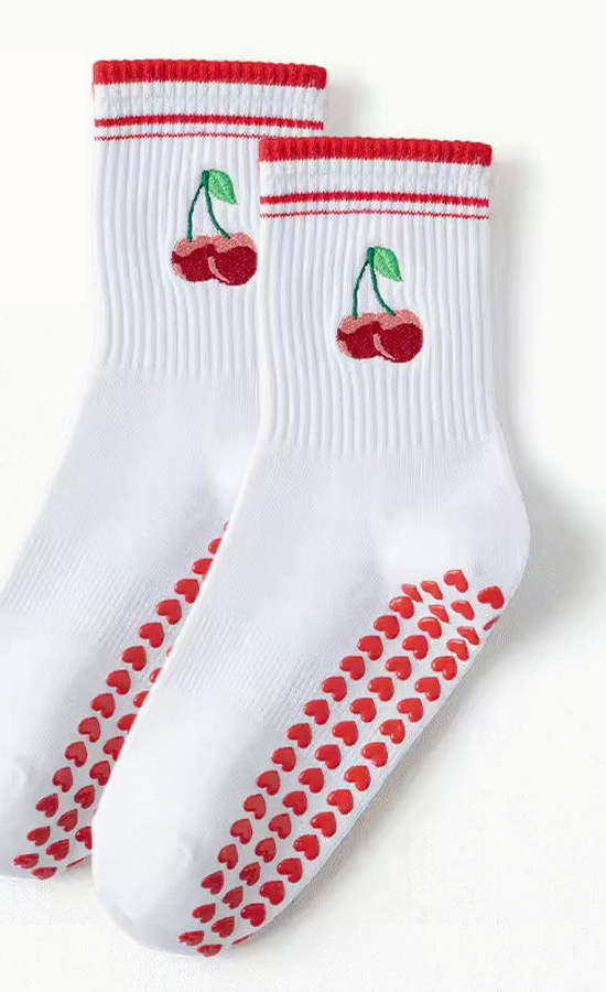 Custom white grip socks with cherry embroidery and heart-shaped sole grips