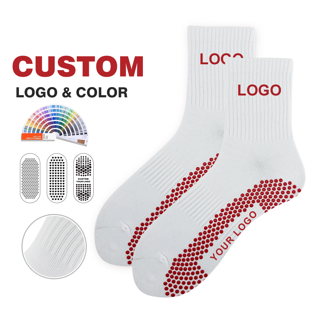 White ribbed crew grip socks with visible red round full-sole grip dots